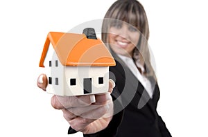 Woman holding a small house