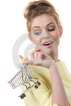 Woman holding small shopping cart