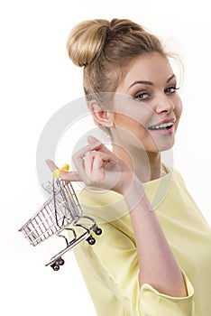 Woman holding small shopping cart