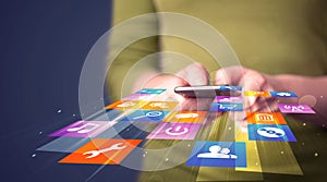 Woman holding smart phone with colorful application icons