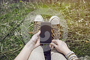 Woman Holding Smartphone In Sunny Day