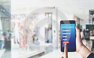 Woman holding smartphone to enter online payment from the store. Concept of providing marketing services on the internet.