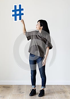 Woman holding a social network icon