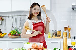 Woman holding spatula.