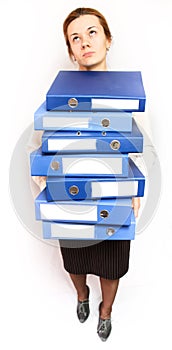 Woman holding stack of folders