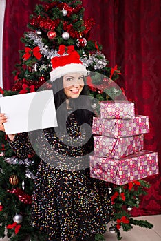 Woman holding stack of presents