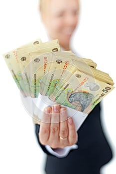 Woman holding stacks of romanian currency