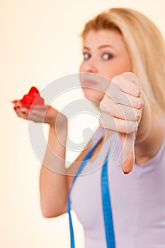 Woman holding strawberry sweet cupcake