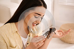 Woman holding striped knee tarantula. Exotic pet