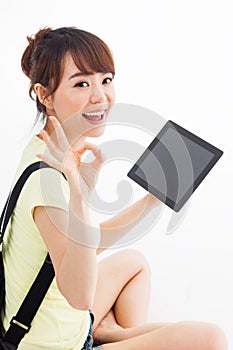 Woman holding tablet computer