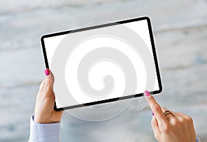 Woman holding tablet with empty screen photo