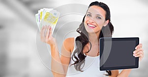 Woman holding tablet and money with bright background