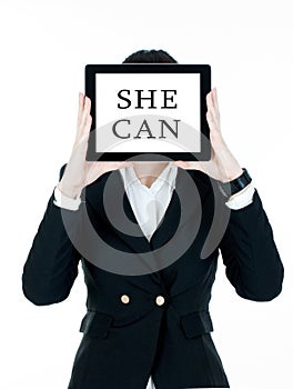 Woman holding tablet pc with words `She can