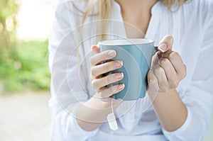 Woman holding tea mug