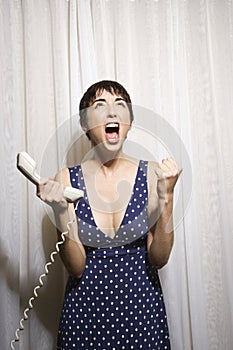 Woman holding telephone