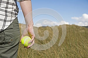 Woman holding tennis ball