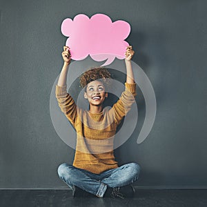 Woman holding thought bubble, chat and speech board for voice opinion, chatting on social media and showing idea