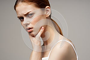 woman holding on to the neck health problems joint studio treatment
