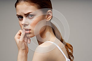 woman holding on to the neck health problems joint studio treatment