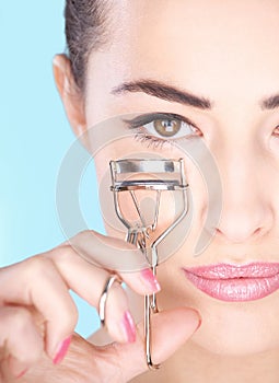 Woman holding tool for eyelash