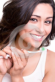 Woman holding a tooth brush