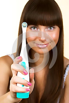 Woman holding a toothbrush