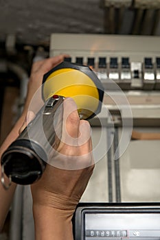 Woman holding a torch, controlling a breaker box, blackout