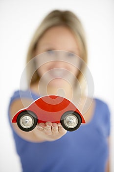 Woman Holding Toy Car