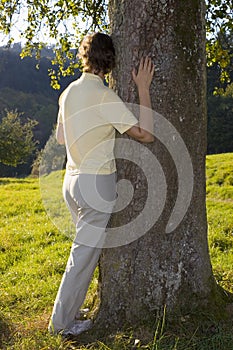 Woman holding a tree