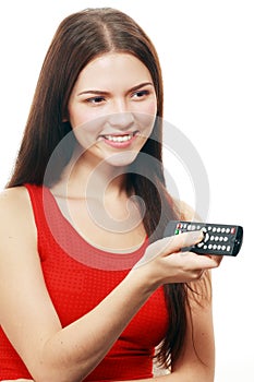 Woman holding TV remote control