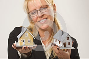 Woman Holding Two Houses