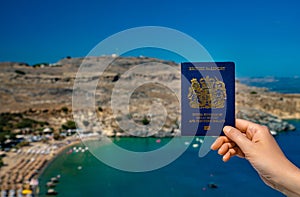 Woman holding UK passport