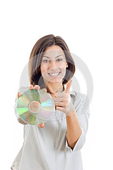 Woman holding up compact disc or cd and looking at camera with t