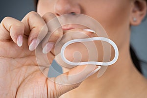 Woman Holding Vaginal Ring