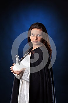 Woman holding vial with shining liquid photo