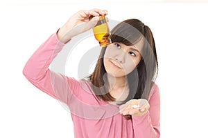 Woman holding vitamin pills