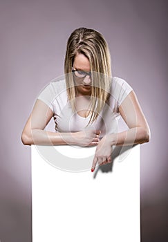 Woman holding a white blank banner.