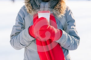 Woman holding winter cup close up