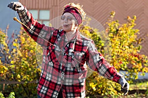 A woman holds an abnormal carrot root in her hands