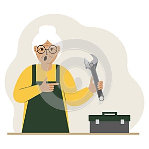 A woman holds an adjustable wrench in his hand and a tool box next to it. The concept of technical repair or service.