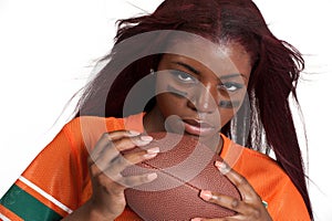 Woman holds american football ball