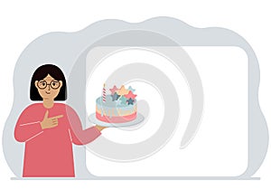 A woman holds a cake in his hand. Nearby is a white poster for text. Birthday or holiday.