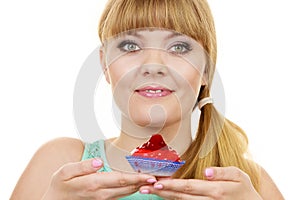 Woman holds cake strawberry cupcake