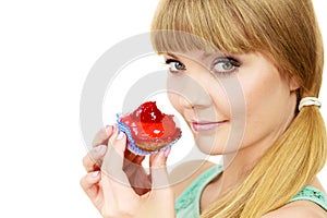 Woman holds cake strawberry cupcake