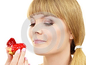 Woman holds cake strawberry cupcake