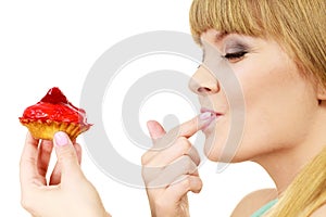 Woman holds cake strawberry cupcake