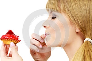 Woman holds cake strawberry cupcake