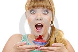 Woman holds cake strawberry cupcake