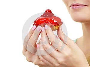 Woman holds cake strawberry cupcake