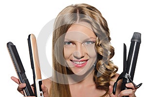 Woman holds curling iron